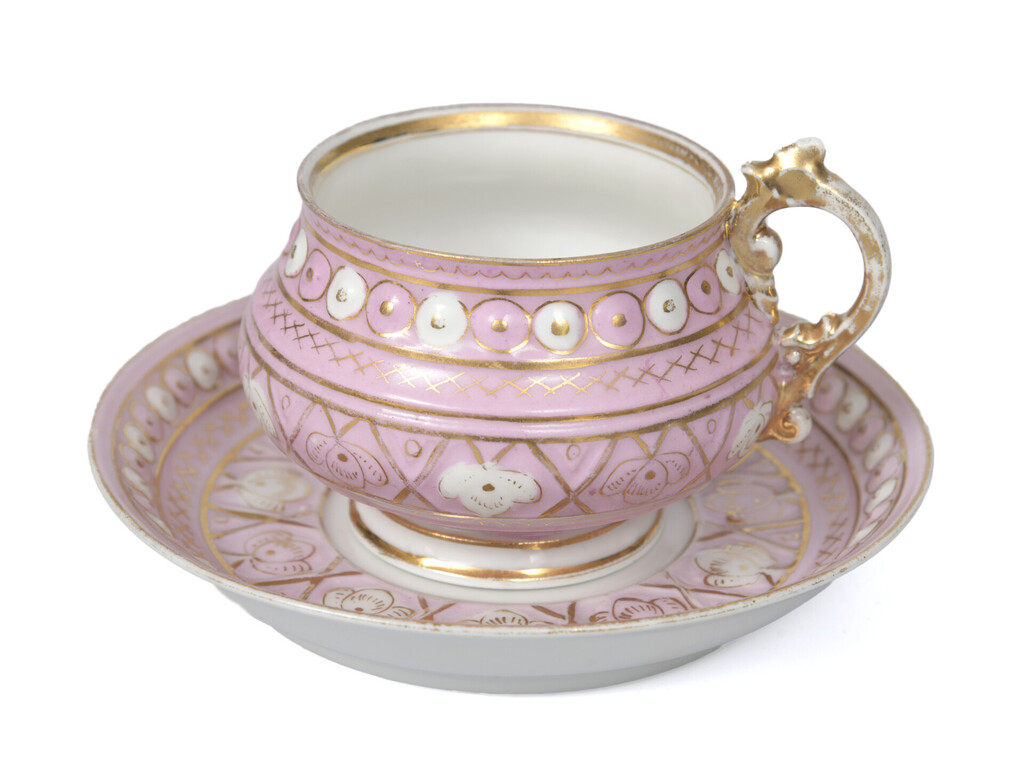 Porcelain cup with saucer in pink color