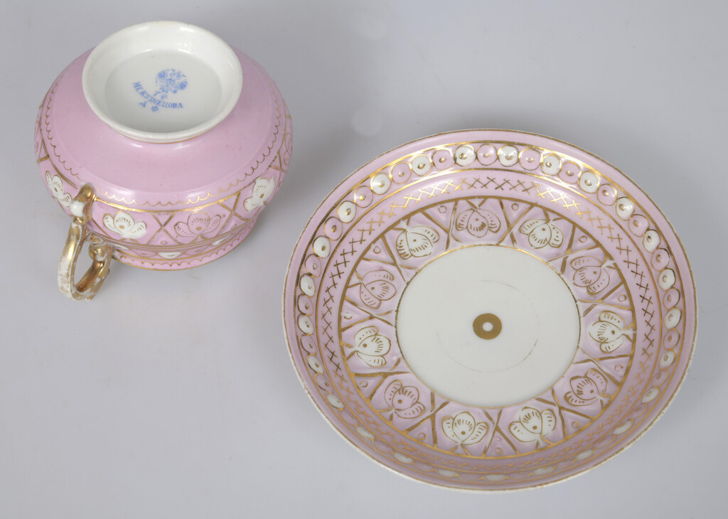 Porcelain cup with saucer in pink color