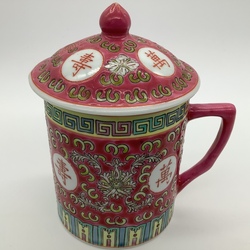Old Chinese tea mug. 1950s. Handmade. Relief technique. Underglaze enamel.