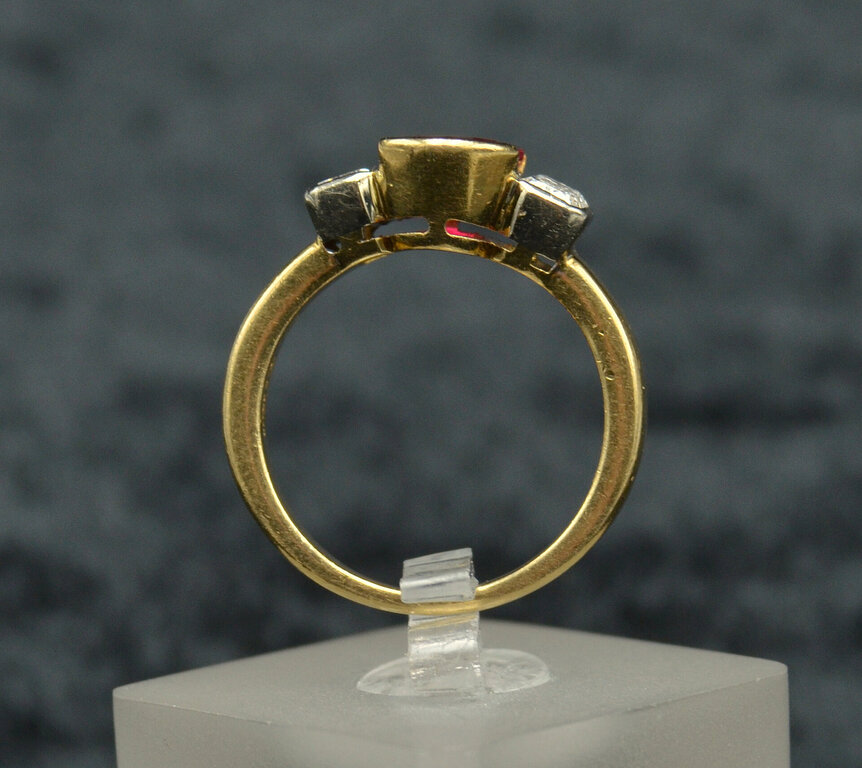 Gold ring with a natural ruby and two natural diamonds