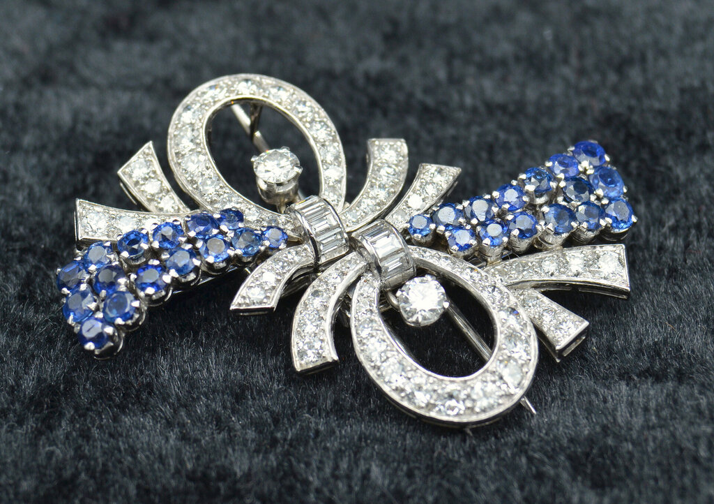 White gold brooch with diamonds and sapphires