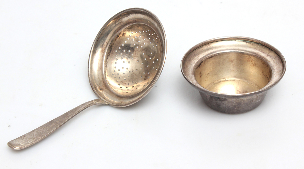 Silver strainer with a dish