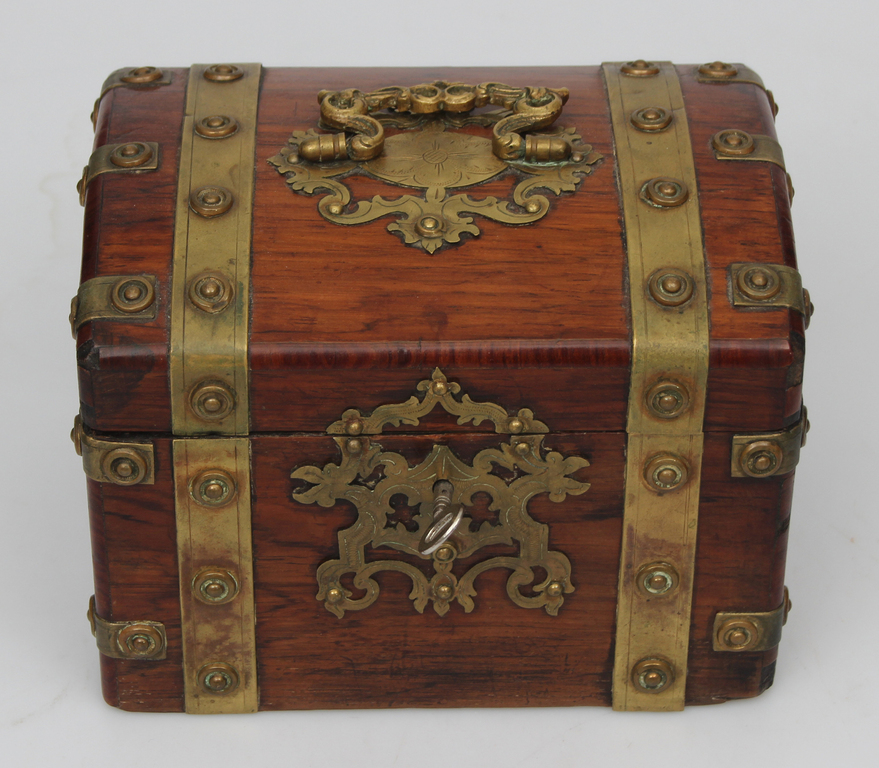 Wooden casket with metal finish and lock