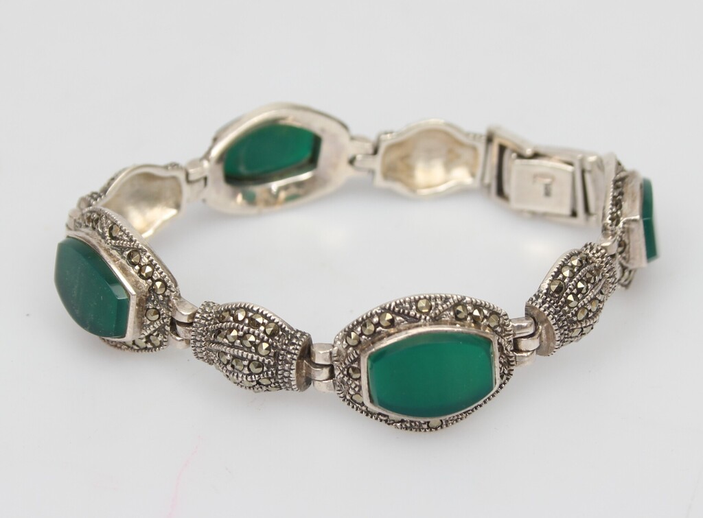 Silver bracelet with green stones