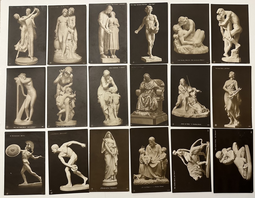 18 postcards with sculptures