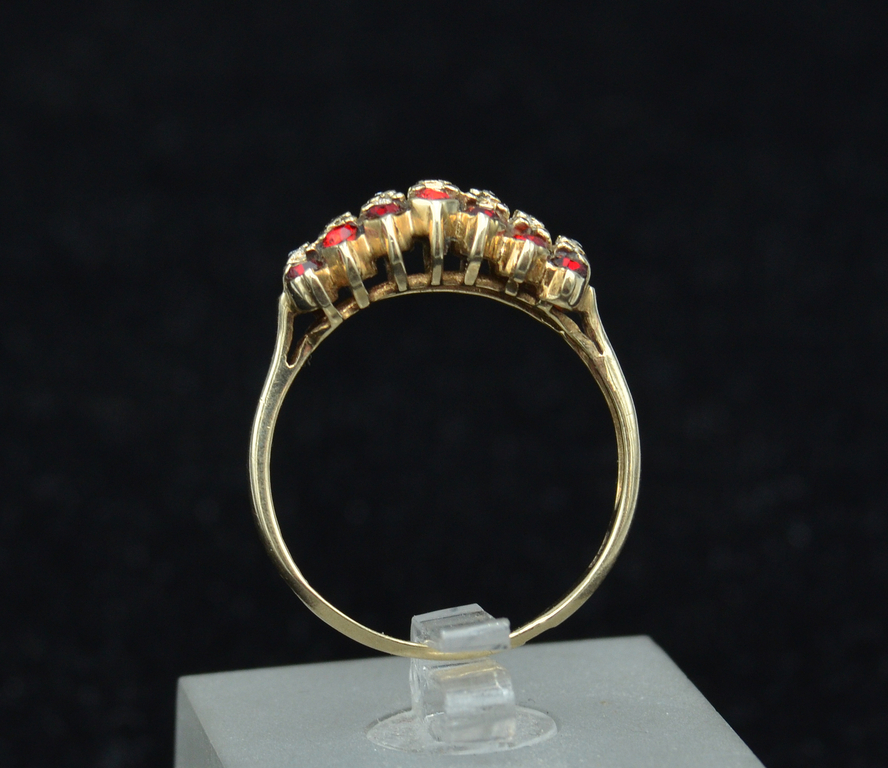 Gold ring with diamonds and glasses