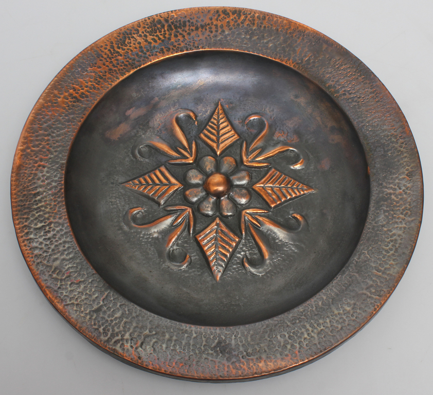 Metal plate with folk motif