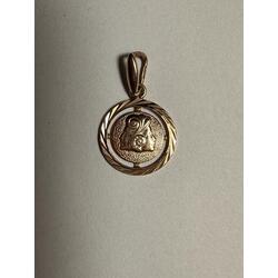 Gold pendant with the zodiac sign 