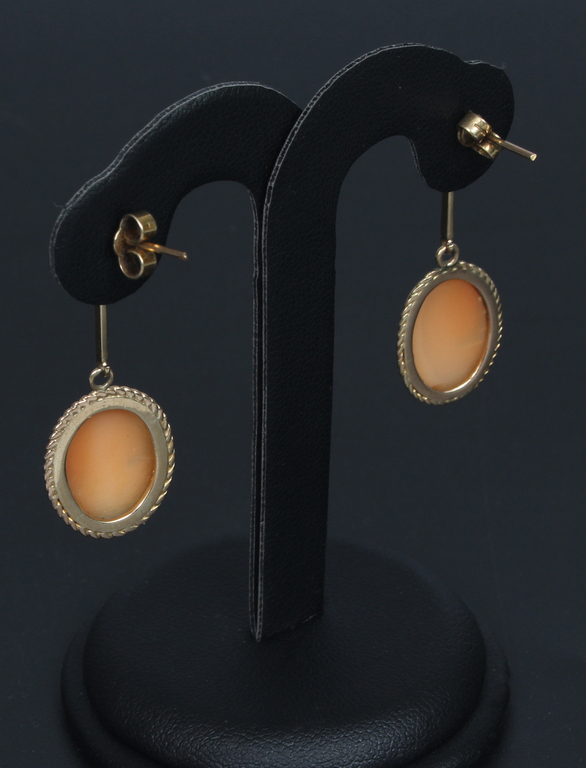 Gold earrings with a cameo
