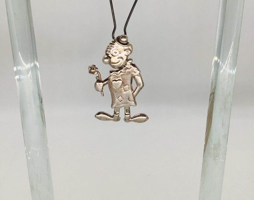 Pendant, Silver. Clown in love. All parts of the body, movable. Last century. France.