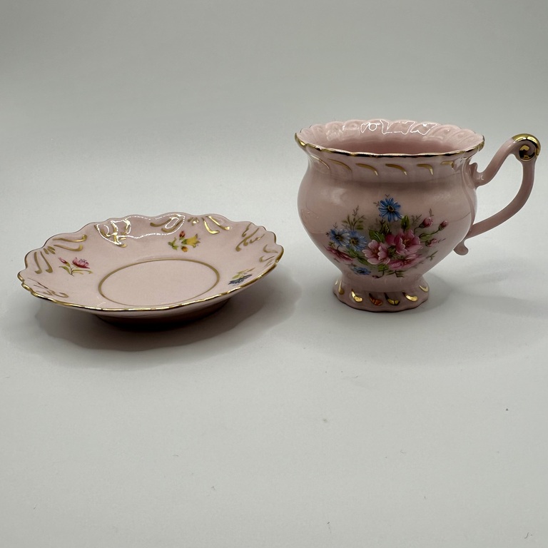 Cup and saucer made of pink porcelain 