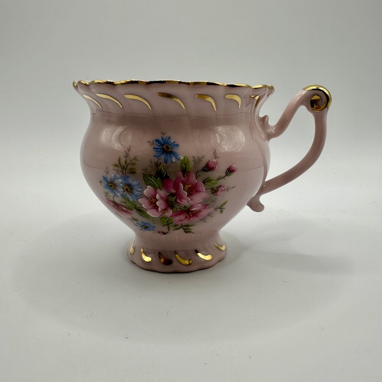 Cup and saucer made of pink porcelain 