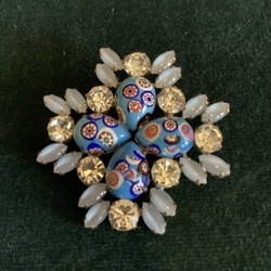 Large brooch with natural rhinestones. Petals made of porcelain and smoked milk glass. Handmade from the beginning of the last century.