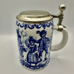 Porcelain beer mug with hand painted cobalt and zinc lid. 