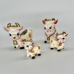 Set of salt, pepper, sugar bowl and creamer. Cow set on the table from the 1960s.
