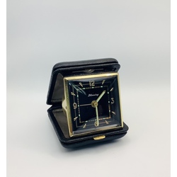 Travel watch in a leather case. Excellent condition. Alarm clock.