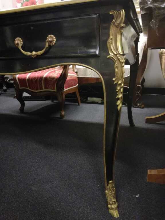Ebony table with leather surface and gilded bronze finishing details