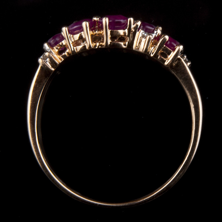 Golden ring with rubies and diamonds